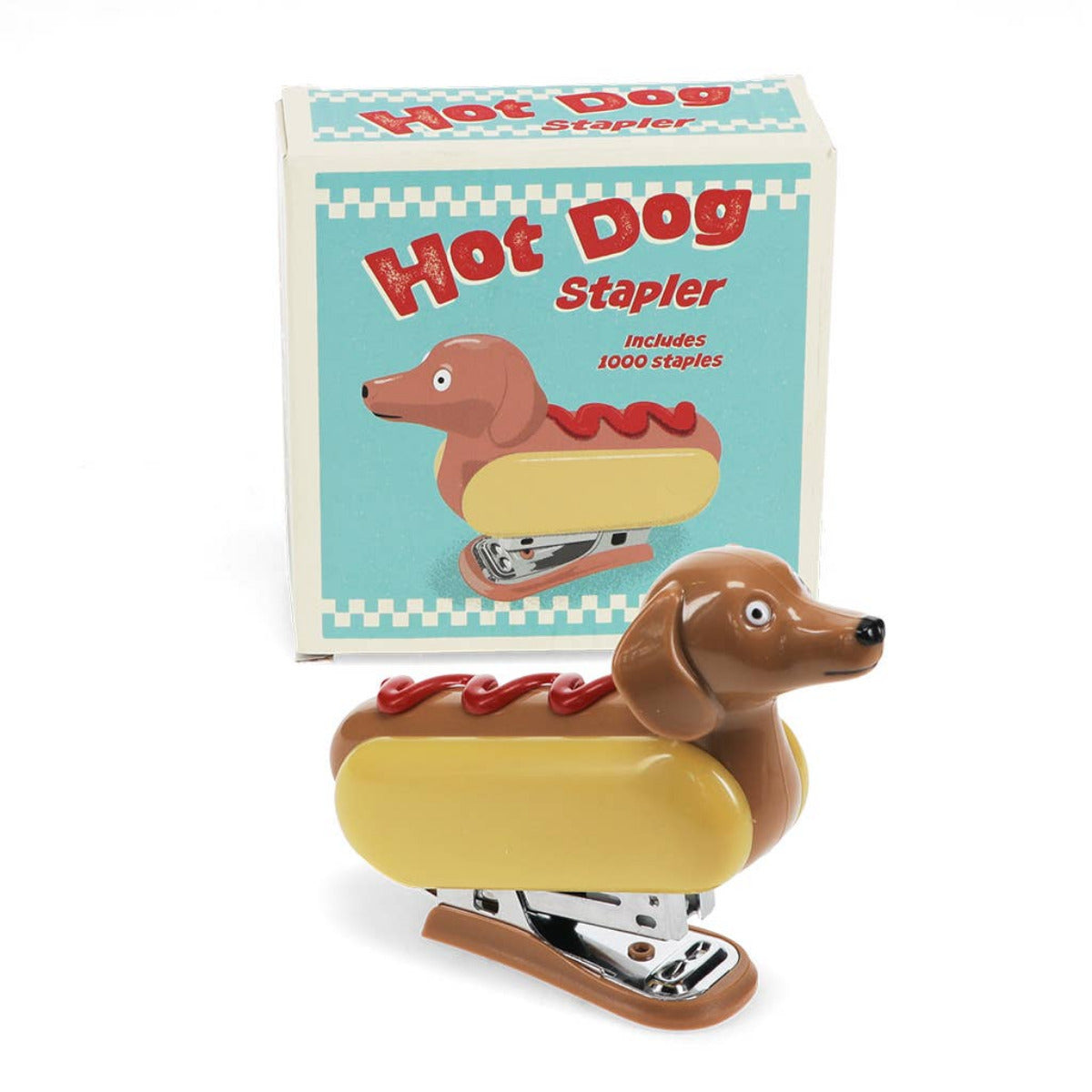 Quirky och nyskapande mini-häftapparat, med en rolig design av en korvhund i ett bröd, med en skvätt ketchup på toppen. En rolig och funktionell kontorsartikel för en hundälskares arbetsplats eller till barnens skrivbord.